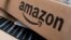 FILE - Amazon boxes are seen stacked for delivery in the Manhattan borough of New York City.