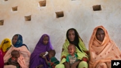In the Sahel belt of Chad, mothers wait for their children to be examined for signs of malnutrition. Governments in the region are struggling to provide food, schools and jobs to their growing populations.