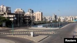 FILE - Empty roads are seen during a curfew to stem the rise in coronavirus disease (COVID-19) infections, in Beirut, Lebanon, Jan. 10, 2021.