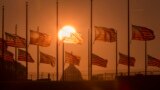 The American flags surrounding the Washington Monument fly at half-staff as ordered by President Barack Obama following the deadly shooting at the Washington Navy Yard, in Washington, D.C.