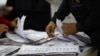 Electoral workers count ballots at the National Electoral Council during the presidential and parliamentary election in Guayaquil, Ecuador, Feb. 9, 2025. 