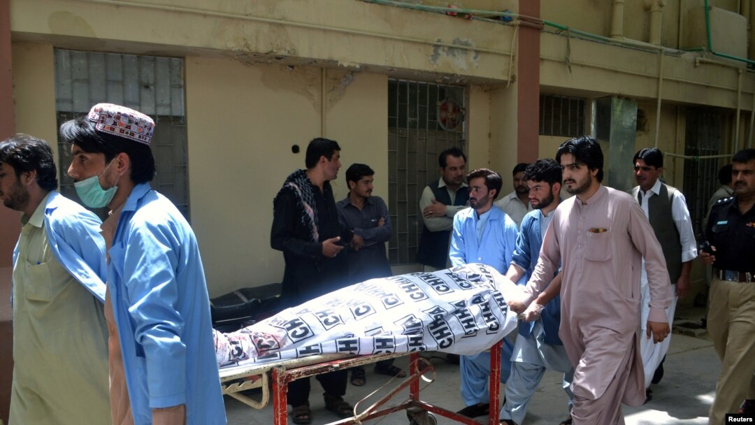 Hospital workers push a stretcher carrying the body of a policeman who was one of the policemen shot dead in Quetta, Pakistan, July 13, 2017.