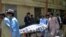 Hospital workers push a stretcher carrying the body of a policeman who was one of the policemen shot dead in Quetta, Pakistan, July 13, 2017.