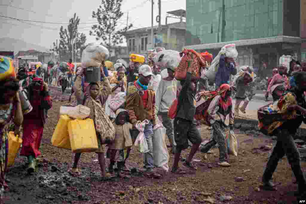 Residents flee from Kibati, where fighting has intensified, towards the city of Goma, Jan. 26, 2025. The M23 armed group has seized further territory in the east of the Democratic Republic of Congo and was continuing to tighten its grip on provincial capital Goma, which is almost surrounded by fighting.