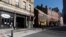A block of closed restaurants on a deserted street ends at Faneuil Hall, right, April 4, 2020, in Boston. The area is usually busy with tourists, but tourism is nearly nonexistent during the coronavirus outbreak.