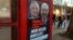 A phone box displays a billboards showing Hungarian-American financier George Soros and EU Commission President Jean-Claude Juncker above the caption “You have a right to know what Brussels is preparing to do!," on Vaci Avenue in Budapest, Hungary, Feb. 19, 2019.