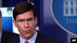 FILE - In this April 1, 2020, file photo, Defense Secretary Mark Esper speaks about the coronavirus in the James Brady Press Briefing Room in Washington, looking for ways to help protects the health and welfare of troops without breaking their morale.