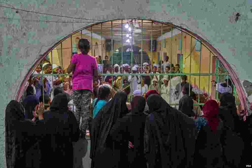 During the ritual of “Ziker,” women are only allowed to watch from backstage. (H. Elrasam/VOA)