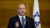 El entonces primer ministro de Israel, Naftali Bennett, hace una declaración en el Knesset, el parlamento israelí, en Jerusalén, el 29 de junio de 2022. 