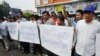 Pro-ruling party demonstrators stage a protest rally in front of National Assembly in Phnom Penh, Cambodia, Oct. 26, 2015.