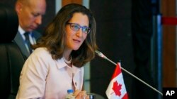 FILE - Canadian Foreign Minister Chrystia Freeland delivers her statement during the ASEAN-Canada ministerial meeting, Aug. 6, 2017 south Manila, Philippines. 