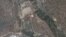Satellite image provided by GeoEye appears to show a train of mining carts, at the lower center of the frame, and other preparations underway at North Korea's Punggye-ri nuclear test site, April 18, 2012.