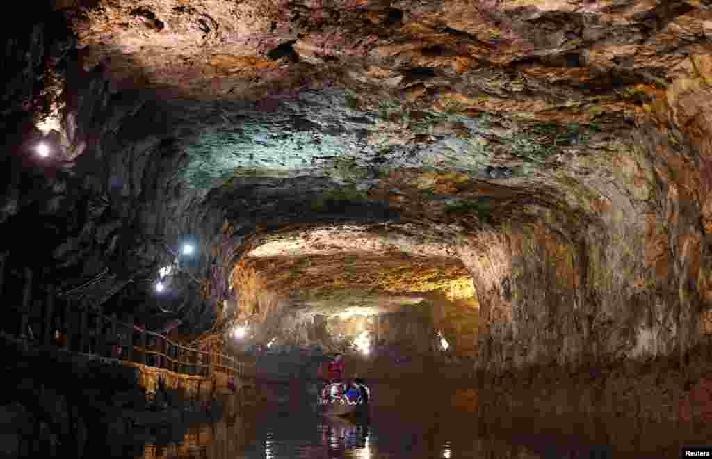 Tourists on a traditional boat sail in the Beihai military water tunnels on the island of Nangan in the Matsu archipelago, off northern Taiwan. The Matsu archipelago, which was once front line against China, is now a military tourist spot.