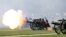 Members of The King’s Troop Royal Artillery fires a round during the 41 Gun Royal Salute marking the 96th birthday of Britain’s Queen Elizabeth, in Hyde Park, London, April 21, 2022.