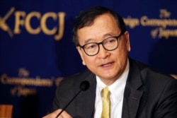 FILE - Cambodia's self-exiled opposition leader Sam Rainsy speaks during a press conference in Tokyo, Japan, April 13, 2018.