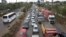 FILE - Drivers sit in queues of traffic on a highway in downtown Nairobi, Kenya, April 14, 2015. Uber is testing a low-cost, quick-trip option in the city. 