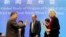 Marion Koopmans, right, and Peter Ben Embarek, center, of the World Health Organization team say farewell to their Chinese counterpart Liang Wannian, left, after a WHO-China Joint Study Press Conference held at the end of the WHO mission in Wuhan, China, 