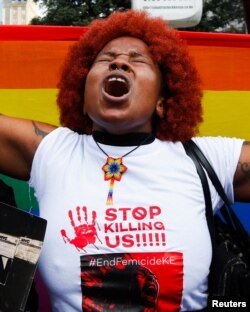 FILE - A human rights activist reacts as she attends a protest demanding an end to femicides in the country in Kenya's capital, Nairobi, January 27, 2024.