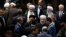 Iran's President Hasan Rouhani, center, leaves the parliament at the end of his swearing-in ceremony for the second term in office, in Tehran, Iran, Aug. 5, 2017.