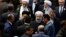 Iran's President Hasan Rouhani, center, leaves the parliament at the end of his swearing-in ceremony for the second term in office, in Tehran, Iran, Aug. 5, 2017.