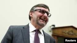 Deputy Assistant Secretary of State for European and Eurasian Affairs Matthew Palmer arrives to testify before a House Foreign Affairs Committee hearing on President Trump's decision to remove U.S. forces from Syria, in Washington, Oct. 23, 2019.