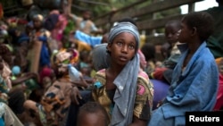 A girl sits at the back of a truck as she prepares to flee sectarian violence in Central African Republic. (File) 