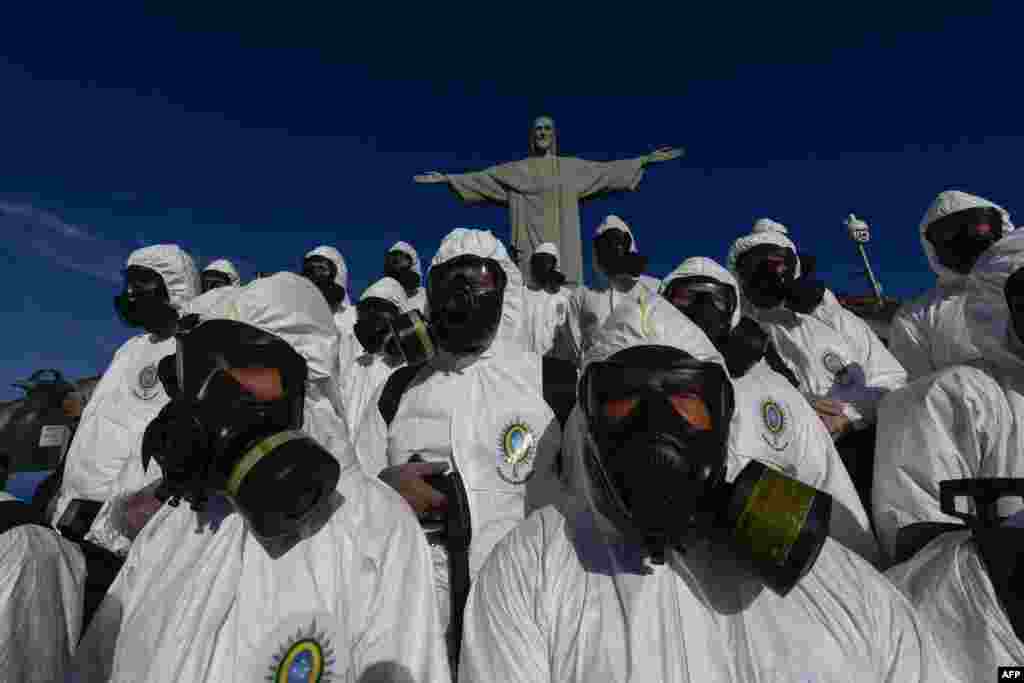 Soldiers of the Brazilian Armed Forces are seen during the disinfection procedures of the Christ The Redeemer statue at the Corcovado mountain prior to the weekend opening of the touristic attraction, in Rio de Janeiro, Brazil.