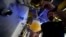 Head Brewmaster Tobias Zollo fills beer at the Weihenstephan brewery in Freising, Germany, Sept. 20, 2024.