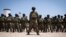 FILE - Mozambican soldiers stand in formation in Pemba, Cabo Delgado province, Mozambique, Sept. 24, 2021.