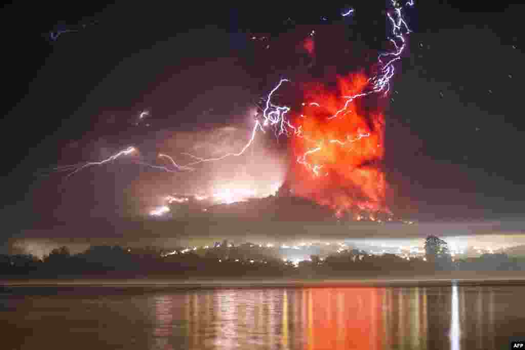 This view from Puerto Varas, southern Chile, shows a high column of ash and lava spewing from the Calbuco volcano, April 23, 2015.