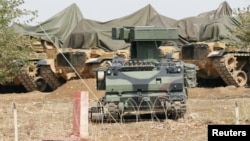 A mobile missile launcher is positioned at a military base on the Turkish-Syrian border at Suruc in Sanliurfa province, October 6, 2012. 