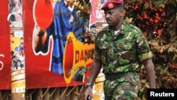 FILE - Muhoozi Kainerugaba, a son of Uganda's President Yoweri Museveni, has been promoted to the rank of major general, prompting speculation about possible future succession. He's shown in 2010.
