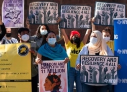 FILE - Demonstrators with the New York Immigration Coalition rally asking President Joe Biden to prioritize immigration reform, Nov. 9, 2020, in New York.