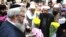 Members of the British Muslim Forum and religious leaders from Christian and Jewish faiths pay their respects at St Ann's square in Manchester, England Sunday May 28, 2017.