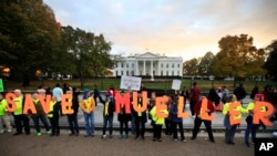 Protesters gather in front of the White House in Washington, Nov. 8, 2018, as part of a nationwide "Protect Mueller" campaign.