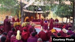 FILE - Monks gather at the Kirti monastery. Losang Thubten, a young monk who recently was detained by police, is said to be a member of Kirti monastery, whose monks have long protested regulations imposed on Tibetan monasteries by Chinese officials.