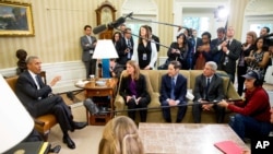 U.S. President Barack Obama speaks to members of the media after receiving a briefing on the ongoing response to the Zika virus from members of his public health team, Friday, May 20, 2016, in the Oval Office at the White House in Washington. 