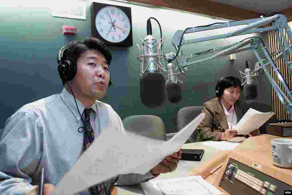 Staffers Tenzin Lhundup (left) and Tseten Chodon present the Tibetan Service's daily newscast