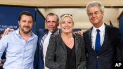 French far-right National Front party leader Marine Le Pen, (2nd-R) poses for photographers with Dutch far-right Freedom Party leader Geert Wilders (R), Austria's Secretary General of the Freedom Party Harald Vilimsky (2nd-L), and Federal Secretary of Ita