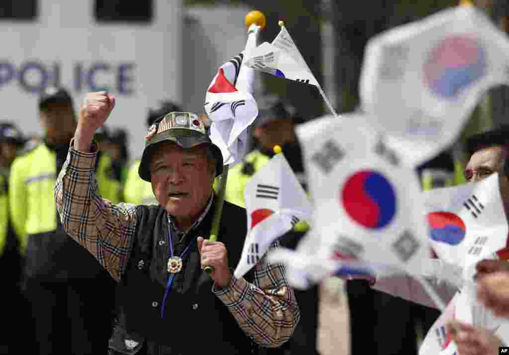 South Korean conservative activists shout slogans as police block them from attempting to release balloons with leaflets during a rally at the border city with North Korea, in Paju, South Korea. A North Korean launch of a missile on the birthday of its revered founder appears to have failed, South Korean and U.S. defense officials said Friday.