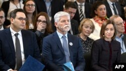 FILE - The President of the Republic of Moldova Maia Sandu (R), Czech President Petr Pavel (C) and Czech Foreign Minister Jan Lipavsky (L) attend the 27th Forum 2000 conference held under the theme "For a Democratic World Order" on October 16, 2023 in Prague, Czech Republic.