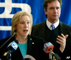 Congressman Brian Higgins listens as Sen. Kirsten Gillibrand, D-N.Y., left, speaks during a news conference in the University at Buffalo Bioinformatics Center of Excellence in Buffalo, N.Y., Jan. 31, 2009.