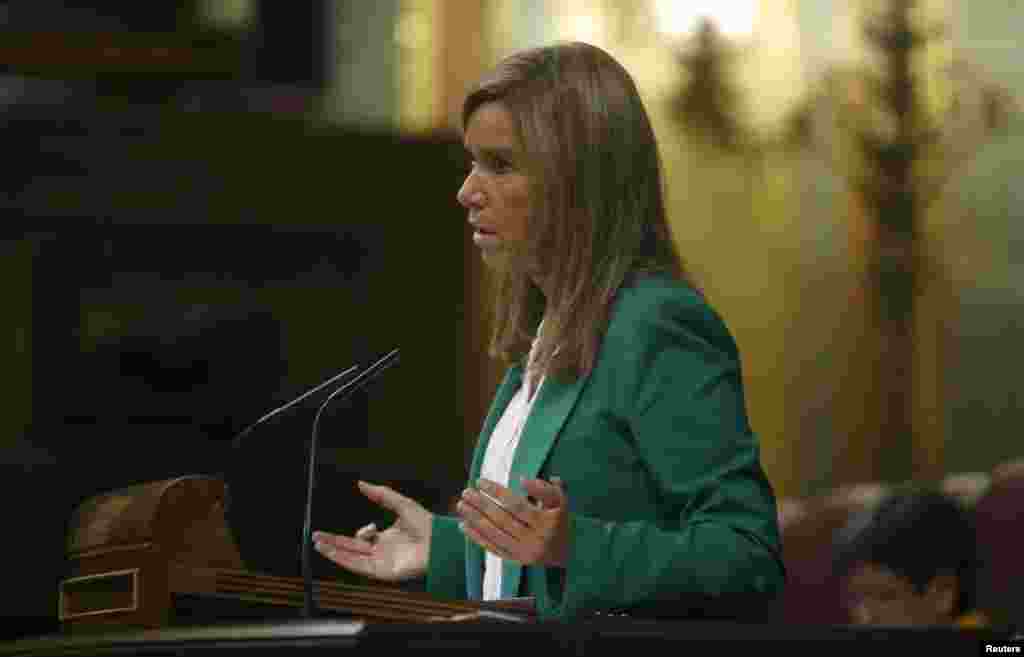 Spanish Health Minister Ana Mato answers a question in parliament about the Ebola crisis, in Madrid, Oct. 15, 2014.