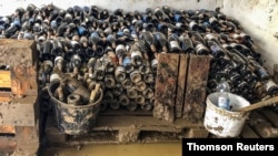 Wine bottles are pictured at the flood-affected Sermann vineyard in Altenahr, Germany, July 23, 2021.