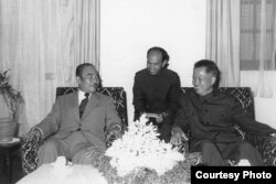 Suong Sikoeun, middle, a former high-ranking Khmer Rouge diplomat, served as interpreter during a meeting between Khieu Samphan, right, and Prince Souphanouvong, president of Laos, in the mid-1970s. (Photo provided by Suong Sikoeun)