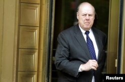 FILE - Lawyer John Dowd exits Manhattan Federal Court in New York, May 11, 2011.