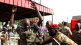 A South Sudanese soldier is checked as he arrives for a sentencing over the rape of foreign aid workers and the murder of a local journalist in an assault on the Terrain Hotel in the capital Juba in 2016 at a military court in Juba, South Sudan, Sept. 6, 2018.