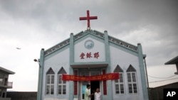 Wuxi Christian Church with the words "Church of Jesus" in red, in Longwan, Wenzhou in eastern China's Zhejiang province. (File)