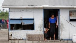 FILE - In this April 7, 2019, file photo, locals prepare to leave their house in Nuku'alofa, Tonga. The largest cluster of places without the coronavirus can be found in the scattered islands of the South Pacific. 