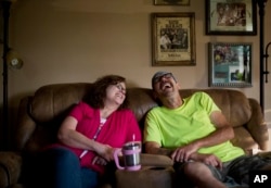 Jeff McCoy, right, a recovering opioid addict, laughs with his wife JoAnne at their home in Dickson, Tennessee, June 7, 2017. Now, he says his wife is his addiction. "She's my everything, she's my drug."